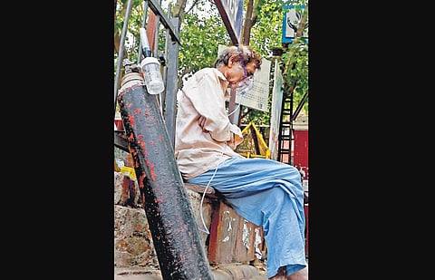 A Covid-19 patient waits for admission outside the Lok Nayak Jaiprakash Narayan Hospital in New Delhi on Thursday. | Shekhar Yadav