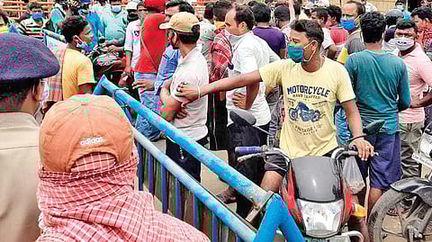 People at the border check post at Udayapur in Balasore district | Express