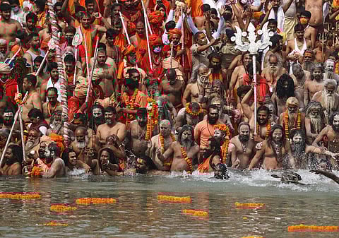 Sadhus take holy dips in the Ganges River during Kumbh Mela in Haridwar, Uttarakhand. Amid spiralling covid cases, many have blamed politicians for allowing super-spreader events such as mass gatherin