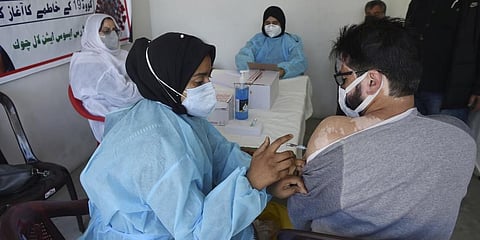 A man receives COVID vaccine in Srinagar on Saturday. (Photo | PTI)