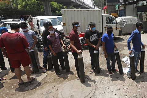 People stand in queues to refill oxygen in cylinders in New Delhi, India, Friday, April 23, 2021. (Photo | AP)