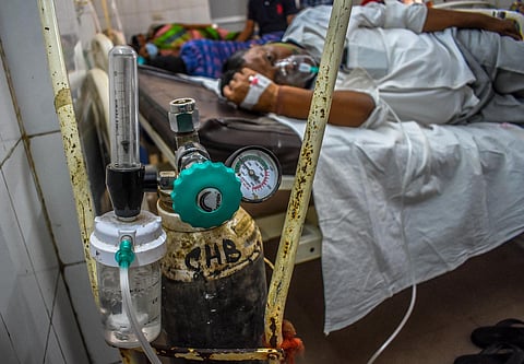 A Covid-19 patient under treatment at Capital Hospital in Bhubaneswar on Sunday. (Photo | Biswanath Swain, EPS)