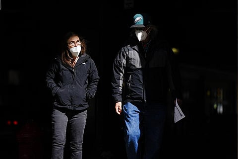 People wearing face masks as a precaution against the coronavirus (Photo | AP)