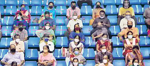Beneficiaries waiting for their turn following Covid protocol at the mass vaccination centre at Jimmy George Indoor Stadium in the capital | B P Deepu