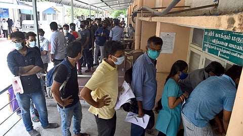 Relatives of Covid-infected patients wait in queue at the special counter opened to buy Remdesivir at Kilpauk Medical College in Chennai. (Photo | Martin Louis, EPS)
