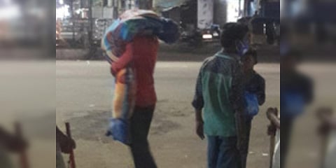 A beggar carried his wife's body on his shoulders to conduct funerals in a burial ground in Telangana's Kamareddy. (Photo| EPS)