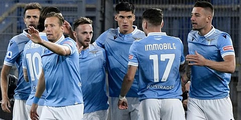 Lazio players celebrate a goal against AC Milan during their Serie A clash. (Photo | AFP)