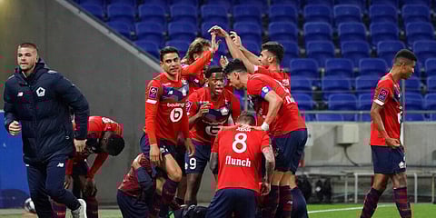Lille' players celebrate after Burak Yilmaz scored a goal against Lyon during their French League One. (Photo | AP)