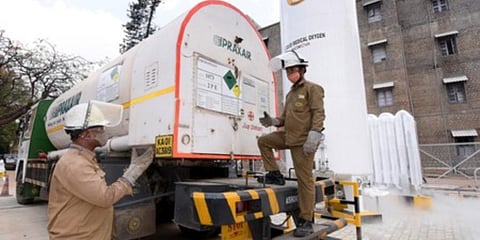 Oxygen tanker drivers Shankar Majhi and Mohammed Hakeekath with their vehicle in Mysuru on Monday | UDAYSHANKAR S
