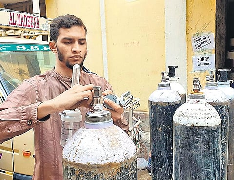 Dr Mohd Sujathullah from the Humanity First Foundation checks oxygencylinders that will be provided to the needy for free in Hyderabad