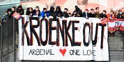 Fans protest against Arsenal owner Stan Kroenke before the English Premier League match against Everton, at the Emirates Stadium in London. (Photo | AP)