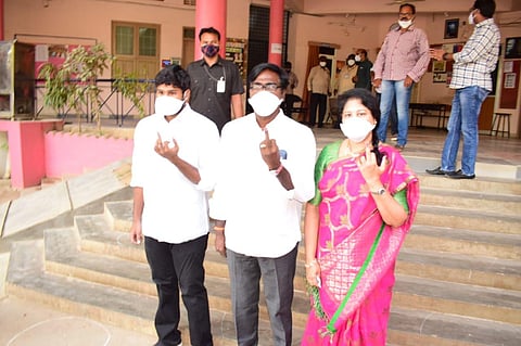 Transport Minister Puvvada Ajay Kumar, along with his family members, exercised his franchise in Khammam Municipal Corporation at a polling booth on Friday. (Photo | Express)