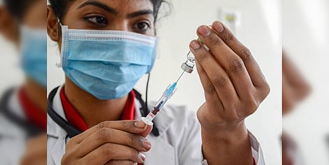 A medical worker prepares to inoculate person with a dose of COVID vaccine, in Amritsar. (Photo| PTI)