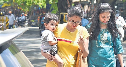 Women without face masks at Gandhi Bazaar on Saturday. Even as Covid cases continue to rise, more and more people fail to wear masks in public places. (Photo | Vinod Kumar T/EPS)