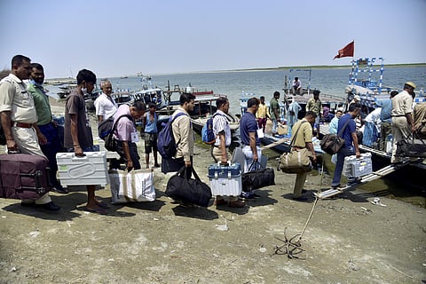 Officials travel towards their polling stations on the eve of 3rd phase of Assam Assembly election , at Chaygaon in Kamrup district, Monday. (Photo | PTI)
