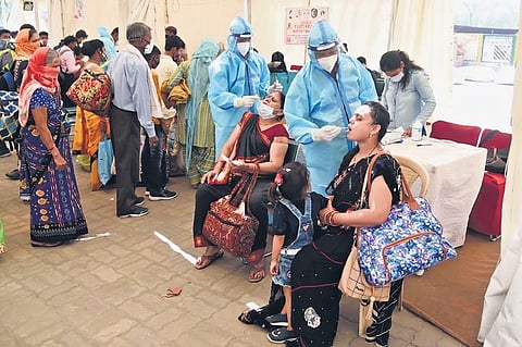 Passengers give swab samples at Anand Vihar ISBT on Sunday. (Photo | Parveen Negi/EPS)