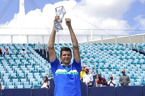 Hubert Hurkacz of Poland poses with the trophy after defeating Yannik Sinner of Italy during the finals of the Miami Open tennis tournament. (Photo | AP)