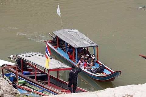 In this March 30, 2021, file photo, Karenni villagers from Myanmar arrive on a boat with an injured person. (File Photo | AP)