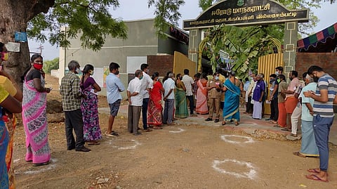 Voters queue up in Erode to cast their vote for TN assembly elections (Photo | Express)