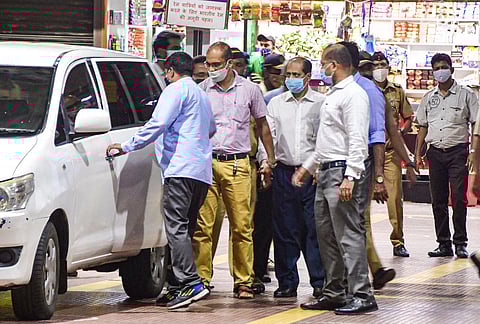 A team of Central Forensic Science Laboratory, Pune with NIA experts recreate the crime scene by taking suspended API Sachin Vaze to a spot at Chhatrapati Shivaji Maharaj Terminus in Mumbai. (Photo |