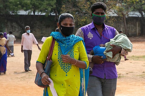 People with their new born arrive to vote at Puducherry on the day of assembly elelctions. (Photo | G Pattabi Raman)