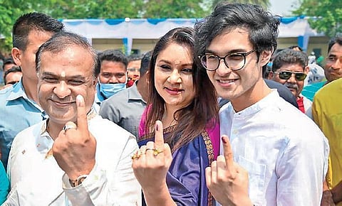 BJP candidate Himanta Biswa Sarma with his wife and son after casting their votes at a polling station at Amingaon in Kamrup district on Tuesday | PTI