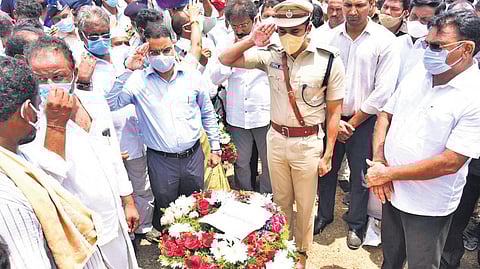 Collector Vivek Yadav, Rural SP Vishal Gunni, and police personnel paying tribute to CRPF jawan Murali Krishna’s body in Sattenapalli on Tuesday | Express