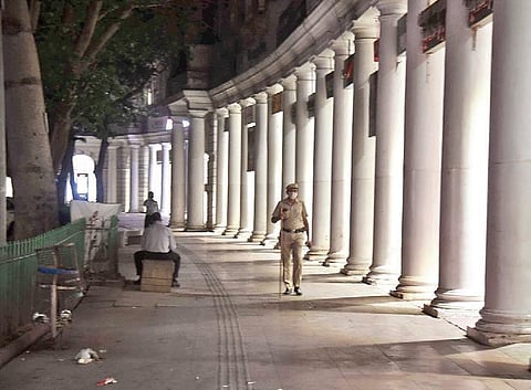 Security personnel stand guard at Connaught Place as night curfew was imposed by Delhi government to curb Covid spread. (Photo | Parveen Negi, EPS)