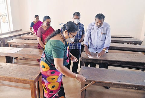 Staff making arrangements for the SSLC and HSE examinations at St Joseph’s HSS in Thiruvananthapuram on Wednesday | Vincent Pulickal