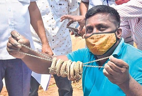 Gold ornaments found in the copper vessel, which was buried in a parcel of land at Pembarthy village in Jangaon district