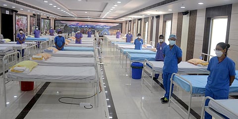 Health care workers are seen at Kishore Bharati Stadium which converted into a COVID Care center in Kolkata. (Photo| ANI)