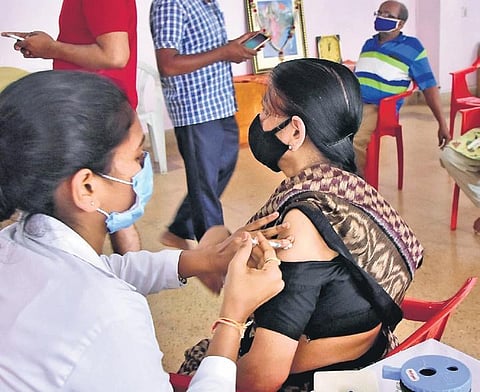 A senior citizen gets vaccinated in Bengaluru on Friday | Express