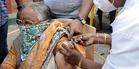 A medic inoculates the dose of the COVID-19 vaccine to a beneficiary, in Bengaluru. (File photo| ANI)