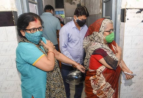 Beneficiaries get vaccinated against COVID-19 at a government run dispensary, in Patna, Monday, May 10, 2021. (Photo | PTI)