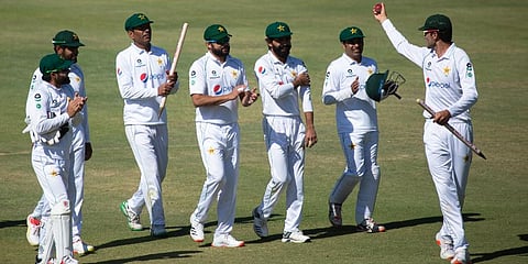 Pakistan bowler Shaheen Shah Afridi, right, holds the ball at the end of test cricket match against Zimbabwe at Harare Sports Club, Harare. (Photo | AP)