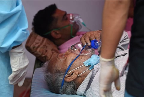 A COVID-19 patient receives free oxygen provided by Sikh organization, as coronavirus cases surge in record numbers across the country, in Indirapuram, Ghaziabad. (Photo | PTI)
