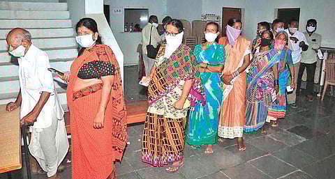 People queue up at a PHC in Jangaon district to undergo Rapid Antigen Test.