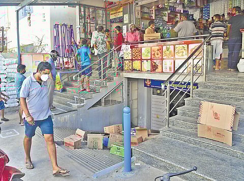 People queue up to buy essentials ahead of the lockdown, in Bengaluru on Sunday. (Photo | Ashishkrishna HP/EPS)