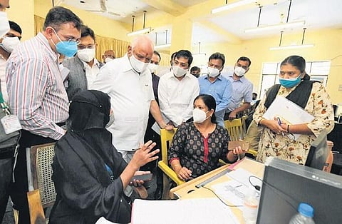 Chief Minister B S Yediyurappa speaks to the staffers at the BBMP war room in Bengaluru on Tuesday | Express