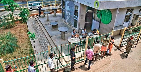 Staff collect Aadhaar and ID proof for food distribution at an Indira Canteen in Dasarahalli on Wednesday | Shriram B N