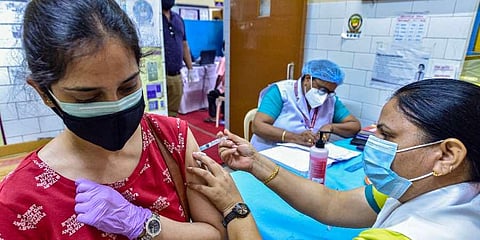A medic administers COVID-19 vaccine to a beneficiary amid the second wave of coronavirus epidemic, in New Delhi. (Photo | PTI)