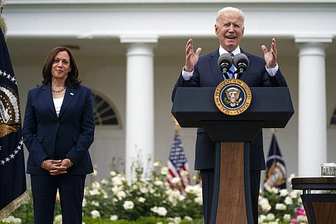 Vice President Kamala Harris listens as President Joe Biden speaks on updated guidance on mask mandates, in the Rose Garden of the White House. (Photo | AP)