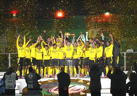 Borussia Dortmund players celebrate after winning the trophy in the German soccer cup (DFB Pokal) final match. (Photo | AP)