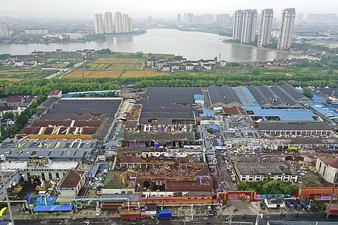 Damage to buildings from a reported tornado is seen in an aerial view in Shengze township in Suzhou in eastern China's Jiangsu Province (Photo | AP)