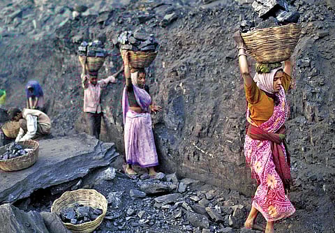Tribals working in a coal mine