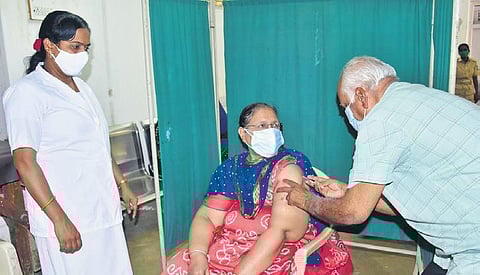 Dr Malhar Rao Malle administers a Covid vaccine at a Primary Health Centre. (Photo| EPS)
