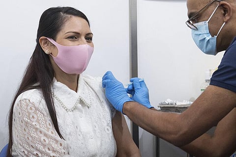 Britain's Home Secretary Priti Patel receives her first dose of the Moderna Covid-19 vaccine. (Photo | AP)