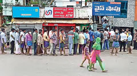 Public flout physical distancing norms as they queue up to buy liquor, in Vijayawada. (File Photo | P Ravindra Babu, EPS)