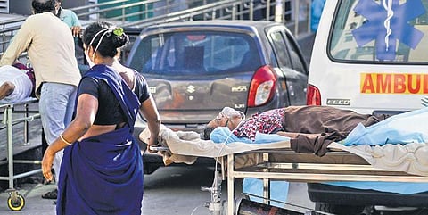 A Covid-19 patient on oxygen-support being shifted to Corona Outpatient Department at Rajiv Gandhi Government General Hospital. (Photo | EPS/DEBADATTA MALLICK)
