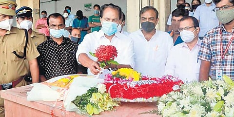 Thrikkakara MLA PT Thomas pay respects to Soumya Santosh, who was killed in a mortar shell attack in Israel, when her body was brought to the Kochi airport. (Photo| EPS)